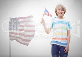 Child holding american flag in front of white background and american flag