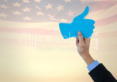 Business man hands holding a 3D thumb up againts american flag