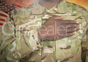 Black soldier with right hand placed on heart for independence day