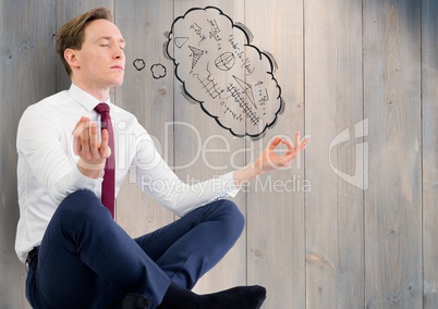 Business man against grey wood panel with 3D thought cloud showing math doodles