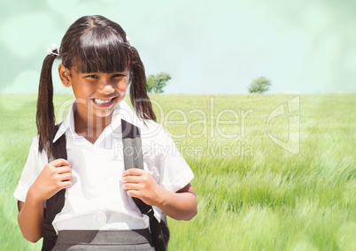 Schoolgirl against meadow