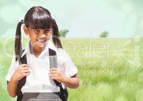 Schoolgirl against meadow