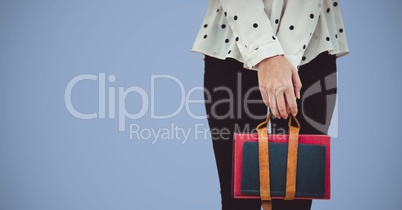 College student lower body with bag against purple background