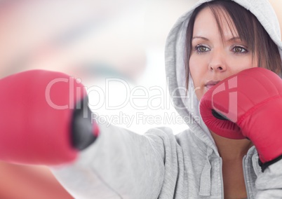 Female boxer posing against red and white abstract background