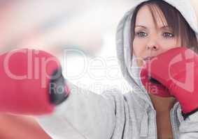 Female boxer posing against red and white abstract background