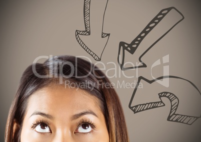 Top of woman's head looking up at downward arrows against brown background