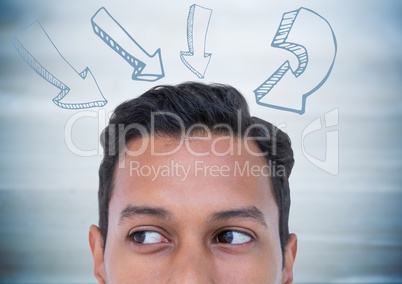 Top of man's head and 3d arrows against blurry blue wood panel