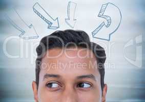 Top of man's head and 3d arrows against blurry blue wood panel