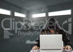 Woman hacker working on laptop in a  dark room
