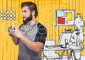 Millennial man with camera against yellow hand drawn office