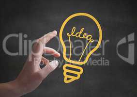 Hand pointing at 3D yellow lightbulb graphics against grey wall