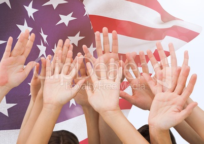 Hands up with fluttering american flag in background