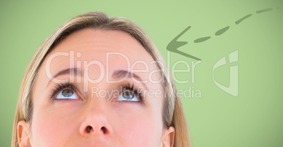 Top of woman's head and green downward arrow against green background