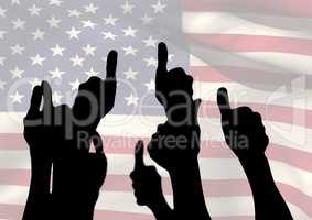Shadow of people with thumbs up against american flag