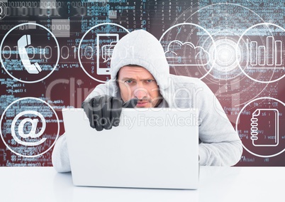 Hacker with gloves using a laptop in front of digital background