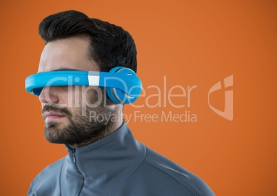 Man in virtual reality headset against orange background