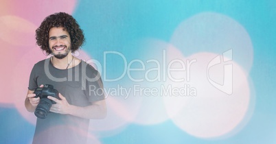 Smiling Photographer against glowing background