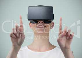 Woman in virtual reality headset against light grey background