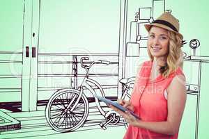 Smiling blond woman using a digital tablet with a 3D green drawing on background