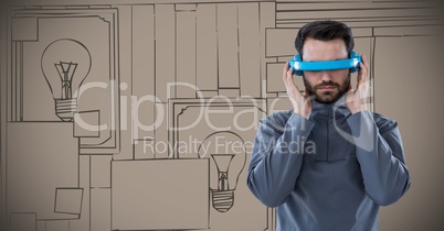 Man in blue virtual reality headset against 3d brown hand drawn wall with pictures