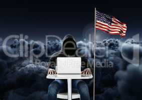 Hacker working on laptop close to the american flag with 3D cloudy background