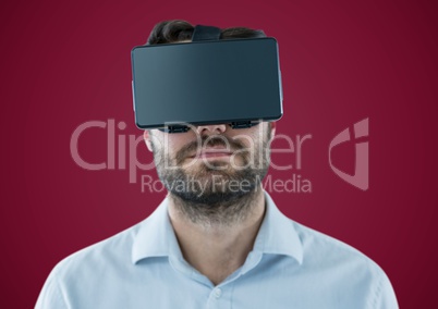 Man in virtual reality headset against maroon background