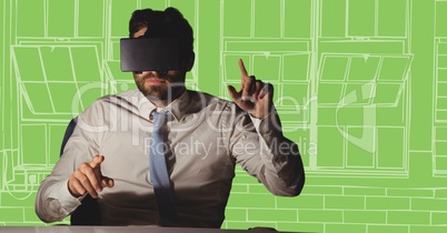 Business man at desk in virtual reality headset against white and green hand drawn windows