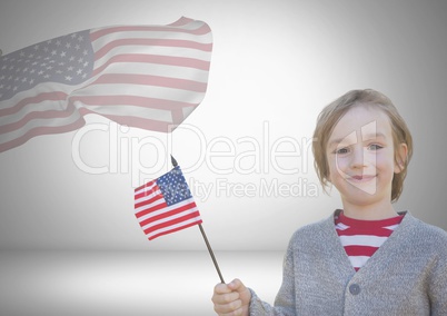 Child holding american flag in front of an other american flag
