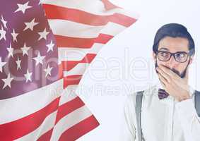 Surprised hipster man looking an american flag on his right