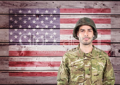 Proud soldier against wooden american flag background