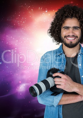 Photographer smiling against galaxy background