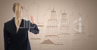 Back of business woman writing city doodle on cream background