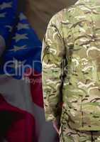 BAck view of soldier in front of american flag