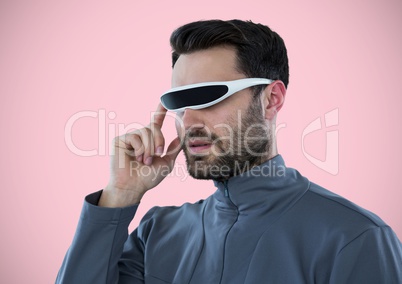 Man in virtual reality headset against pink background