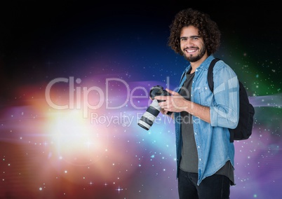 Photographer smiling against galaxy background