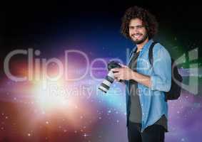 Photographer smiling against galaxy background