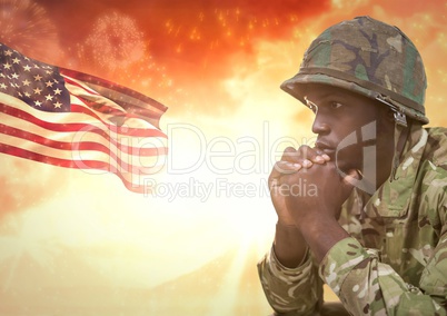 Military thinking against sunset and american flag