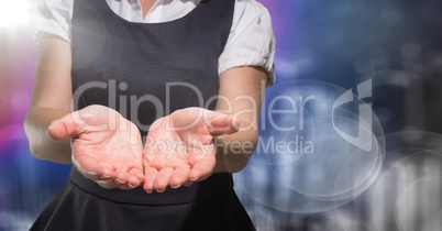 Business woman mid section with hands out and flare against blurry purple wall with city doodle