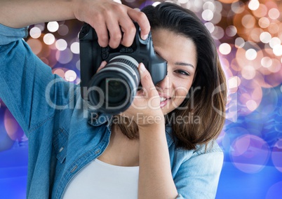 3d happy young photographer taking a photo. Brown, blue and white bokeh background
