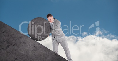 Man pushing rolling round rock