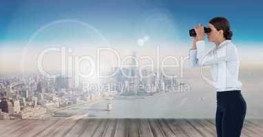 businesswoman with binoculars in cityscape