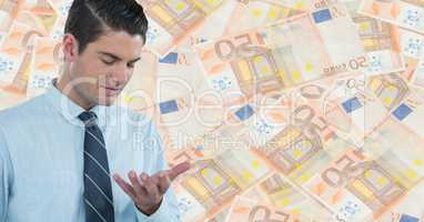 Business man looking at hand against money backdrop