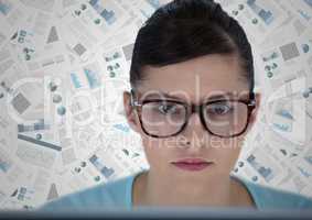 Close up of woman at computer against document backdrop