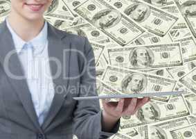 Business woman mid section with tablet against money backdrop