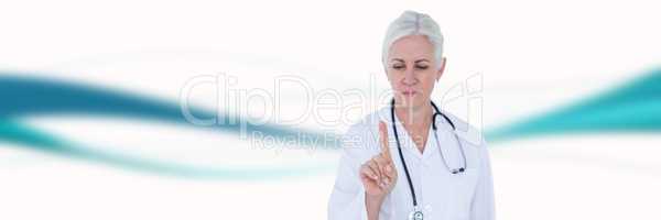 Doctor pointing against blue and white blurred abstract background