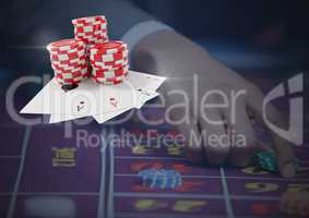 3d Poker chips and cards in front of gambling person table
