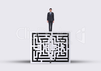 Man looking down on the top of a 3D maze