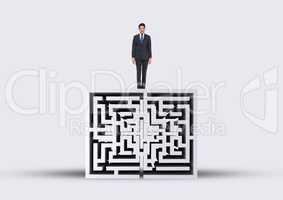 Man looking down on the top of a 3D maze