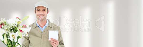 Delivery Courier holding flowers in front of blurred background and copy space on a card