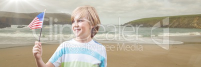 Boy with american flag on beach with flare